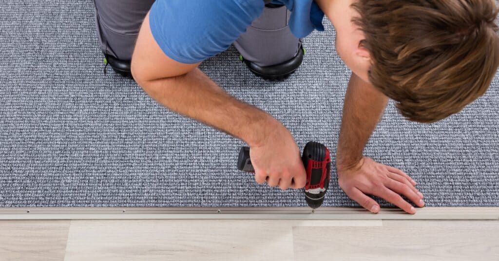 Expert performing commercial carpet stretching and repair in Utah